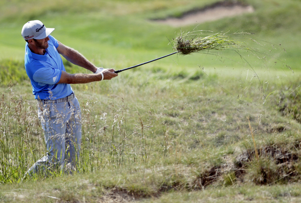 Things got a little rough for first-round leader Dustin Johnson, who was 1 over par for the day and 5 under for the tournament after 14 holes. He’ll be four shots off the lead when play resumes Saturday.