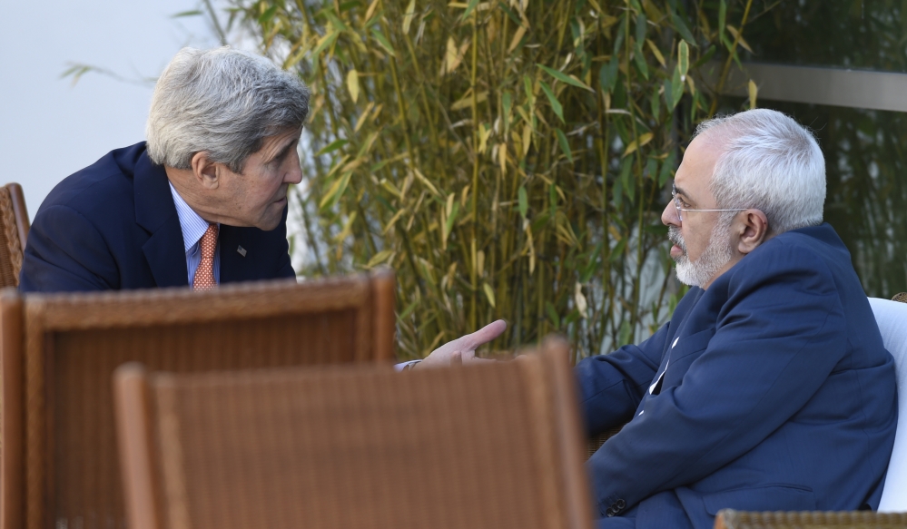 U.S. Secretary of State John Kerry, left, talks with Iranian Foreign Minister Mohammad Javad Zarif in Geneva, Switzerland, in May.