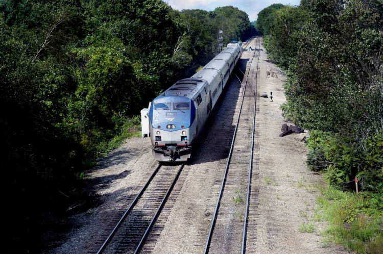 The Downeaster makes its way south in South Portland. Shawn Patrick Ouellette/Staff Photographer