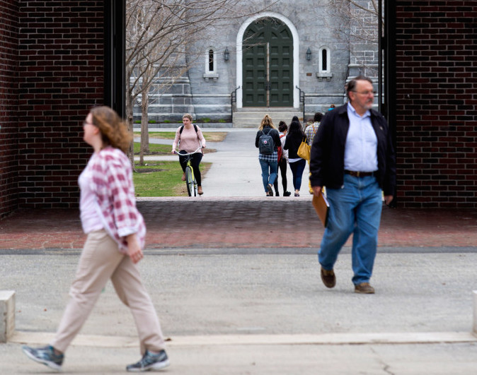 Pedestrians and bicyclists make their way through the Bowdoin College campus in Brunswick. The school is ranked fourth in the nation in U.S. News & World Report's latest rankings.
2015 Press Herald file photo/Gabe Souza