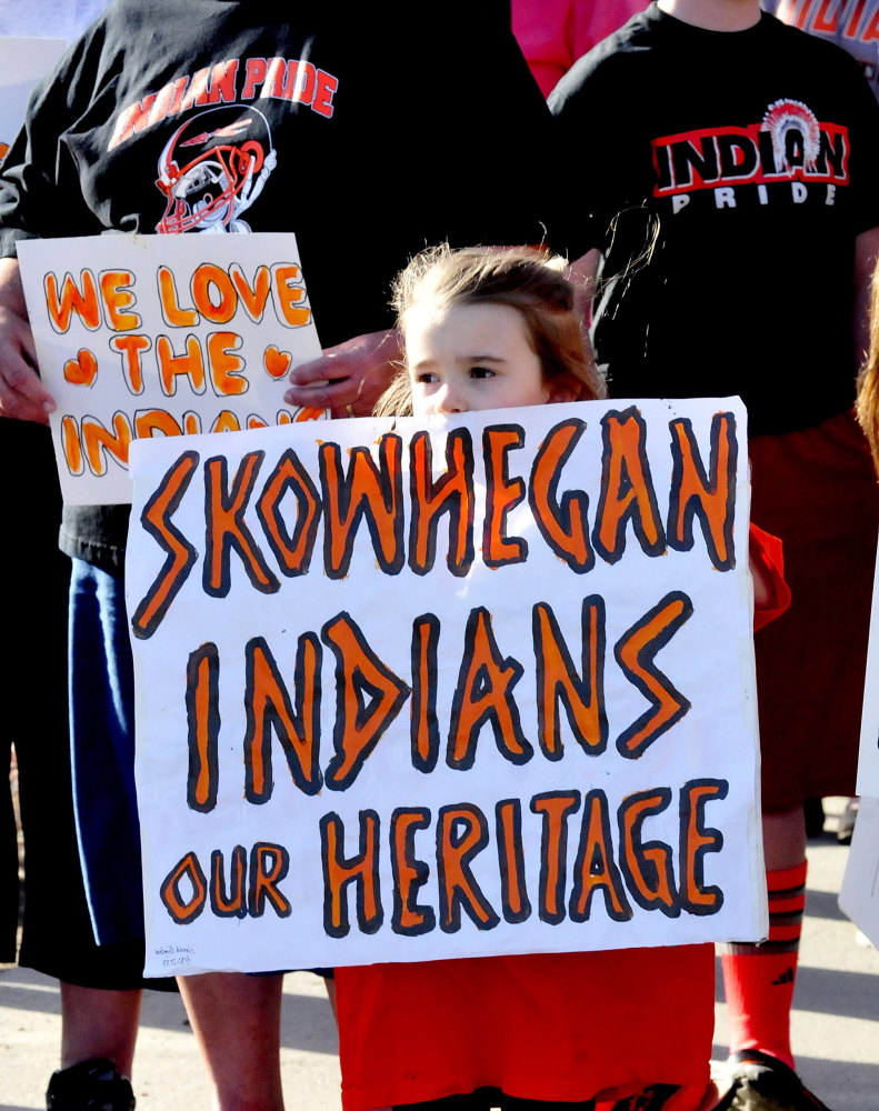 Skylar Carter joins a goupr to show support keeping the Indian nickname and mascot at Skowhegan High School in April. A group supporting keeping the nickname plans a Skowhegan Indian Pride rally on Columbus Day, while Maine Indians and their supporters are holding an Indigenous Peoples Day rally at Lake George in Skowhegna. The events are the latest surrounding the last school in the state that has Native American imagery.