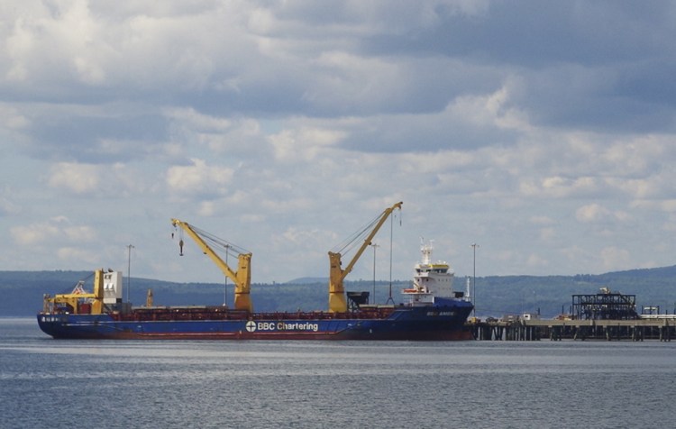 The BBC Amber unloads wind turbine parts in Searsport. A federal plan would deepen the channel from 35 to 40 feet.