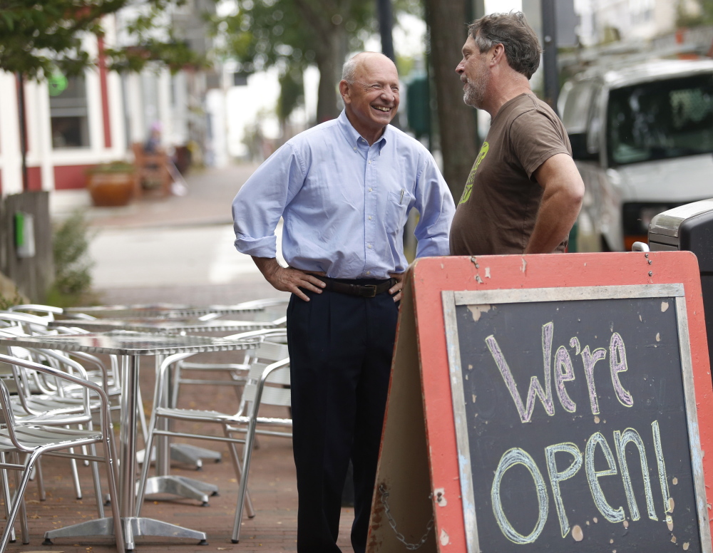 Mayor Michael Brennan talks with Rosemont Market and Bakery co-owner John Naylor before they held a press conference to speak about minimum wages in Portland.
Derek Davis/Staff Photographer