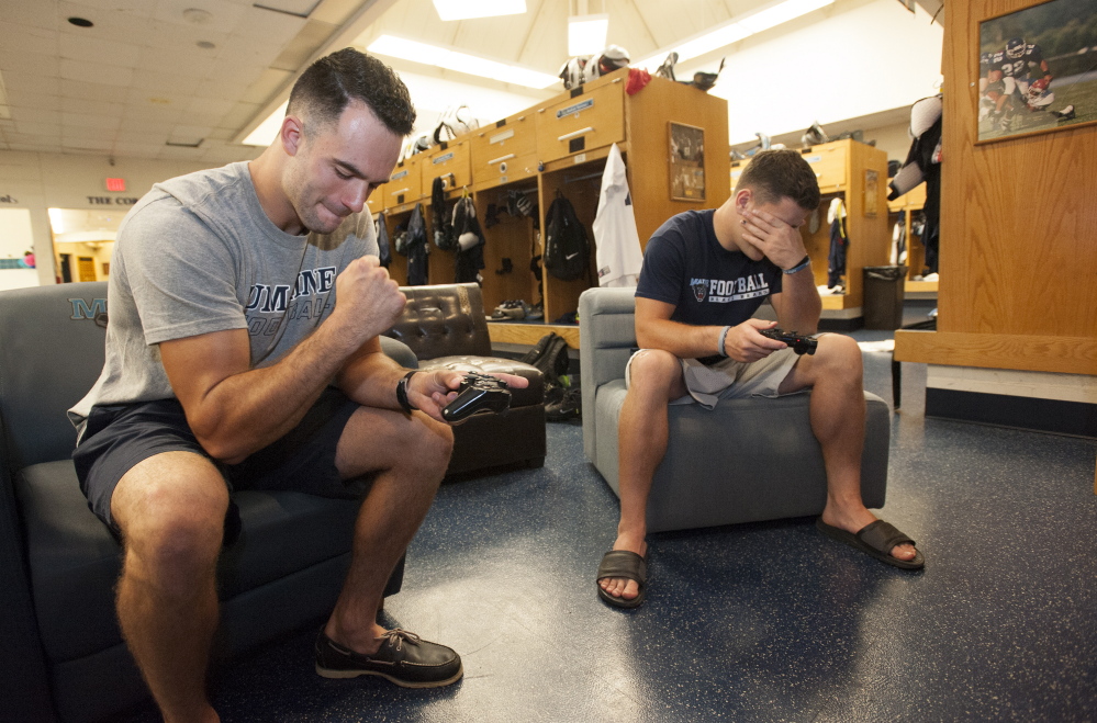 John Hardy, left, is at the top of the depth chart at slot receiver and John McCabe has earned time at linebacker. As for video baseball, guess who wins?