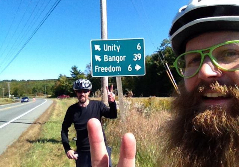 Fred Horch, left, and Asher Platts pedaling to the 2014 fair.