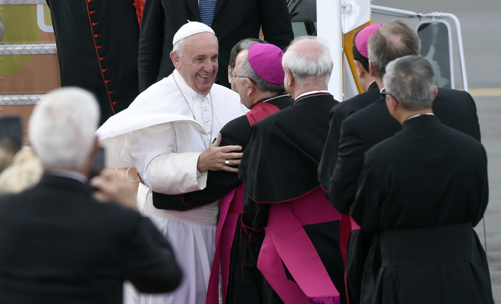 Pope Francis is greeted as he arrives at Philadelphia International Airport in Philadelphia on Saturday. The Pope will spend the last two of his six days in the U.S. in Philadelphia as the star attraction at the World Meeting of Families, a conference for more than 18,000 people from around the world that has been underway as the pope traveled to Washington and New York.
