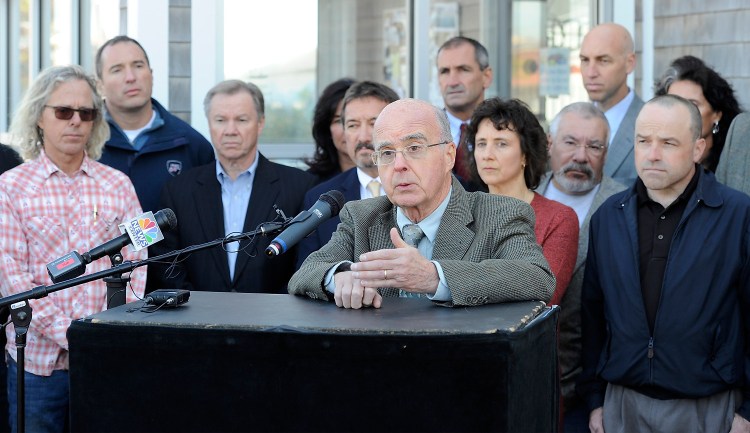 Jim Wellehan, owner of Lamey-Wellehan Shoe Stores, speaks about the harm a proposed referendum to raise the minimum wage would do to the city of Portland as he and other business owners express opposition to the referendum at a news conference at Becky's Diner in Portland on Wednesday.