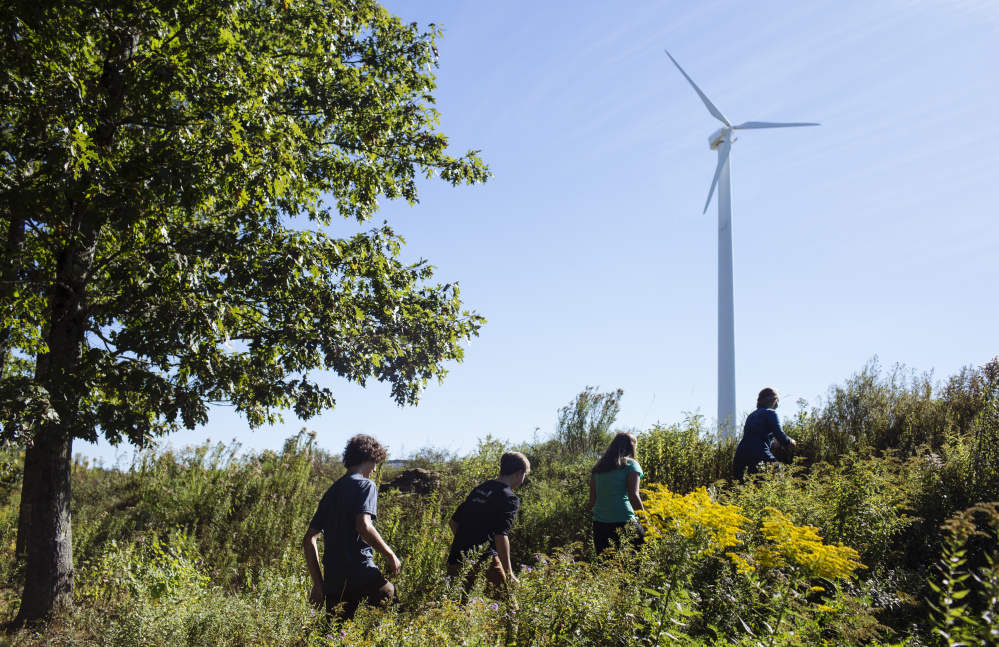 Camden Hills Regional High School students, from left, Aidan Acosta, Shawn Albertson, Annie James and Zoe Zwecker are members of the Windplanners club, which helped raise $500,000 for a wind turbine. Next the club got to work on a solar panel project, and pushed to replace school lights with LEDs.