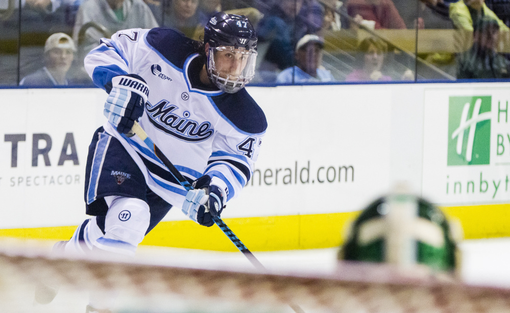 Maine sophomore Mark Hamilton shoots on Michigan State goaltender Jake Hildebrand during Thursday’s 4-3 victory in opening round play of the Ice Breaker.