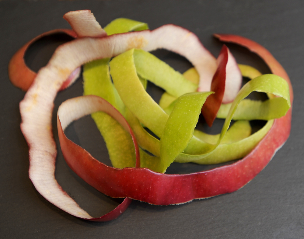 Macintosh and Granny Smith apple peels ready for spices and toasting.