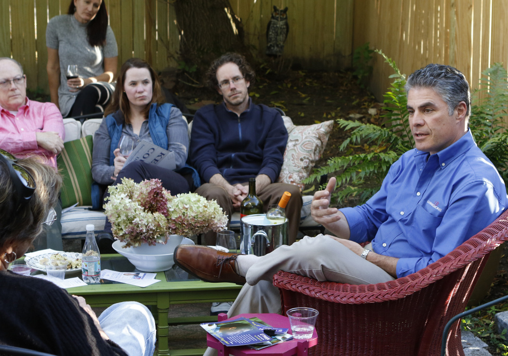 Mayoral candidate Ethan Strimling speaks with voters at a house party Sunday in Portland. He says he’s most proud of his success with LearningWorks, a social service nonprofit in the city.