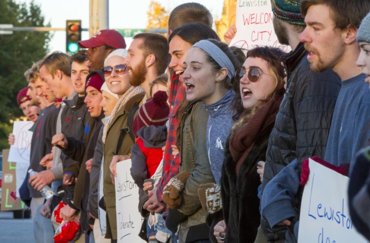 The crowd that gathered Monday to protest campaign signs aimed at mayoral candidate Ben Chin said it was important to show Lewiston is a welcoming city that won’t tolerate hate.