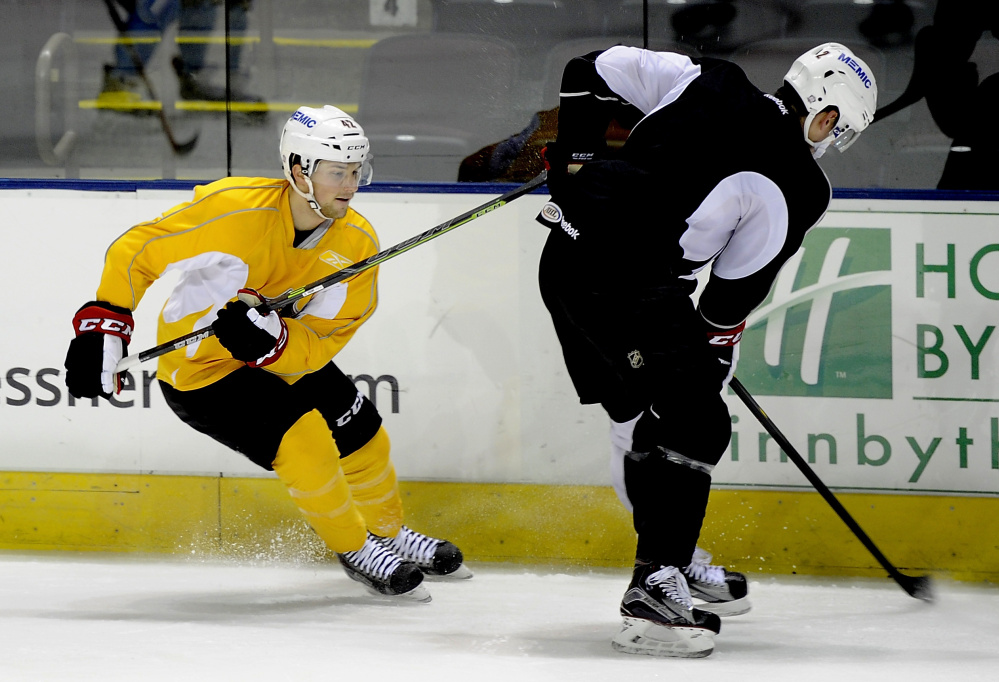 Kyle Rau, left, might be small in stature at just 5-foot-8, but his speed makes him a threat for the Pirates thanks to rule changes designed to speed up the game. Rau has three goals and one assist in three games this season.