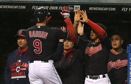 Cleveland Indians DH Ryan Raburn gets congratulations from teammates after hitting a solo home run against the Boston Red Sox in the fourth inning Saturday  in Cleveland. The Indians won 2-0. The Associated Press