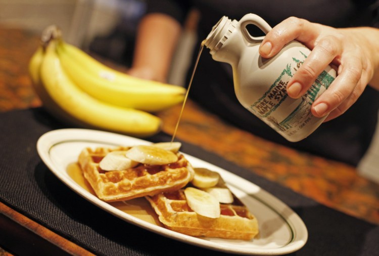 Christine Burns Rudalevige makes banana waffles.
Jill Brady/Staff Photographer