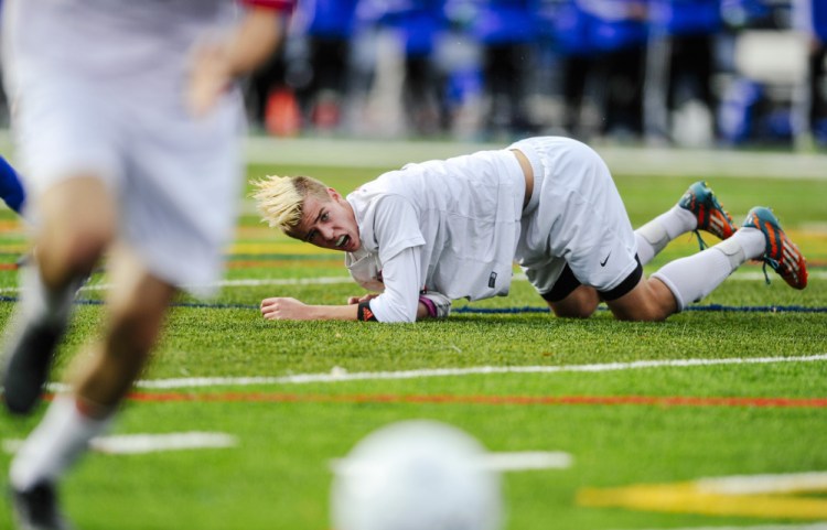 Scarborough defender Spencer Pettingill watches his teammates attempt to defend their goal during the Class A state championship Saturday against Lewiston at Portland’s Fitzpatrick Stadium. Scarborough has a $100-per-sport activity fee.