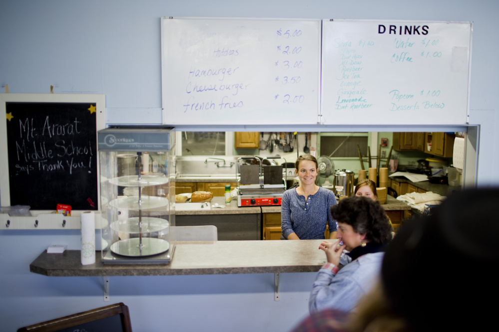 Jenn Legnini greets customers in the cafe at the Winter Farmers’ Market in Topsham.