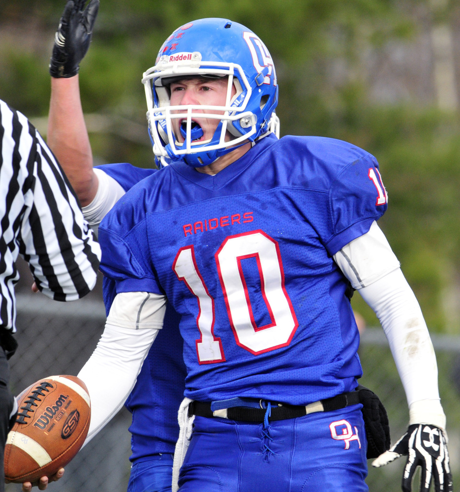 Oak Hill quarterback Dalton Therrien celebrates after scoring a touchdown during the Class D South final Saturday against Lisbon. Therrien rushed for 130 yards and three TDs in a 21-20 win.