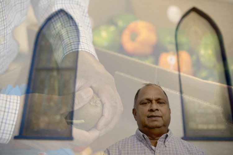 At the First Assembly of God church in Portland, Baby Matthew oversees a pantry operation that gives out 10,000 pounds of food a week. Matthew’s photo is superimposed onto another image as he and other volunteers get the food ready for visitors to pick up.
Gabe Souza/Staff Photographer