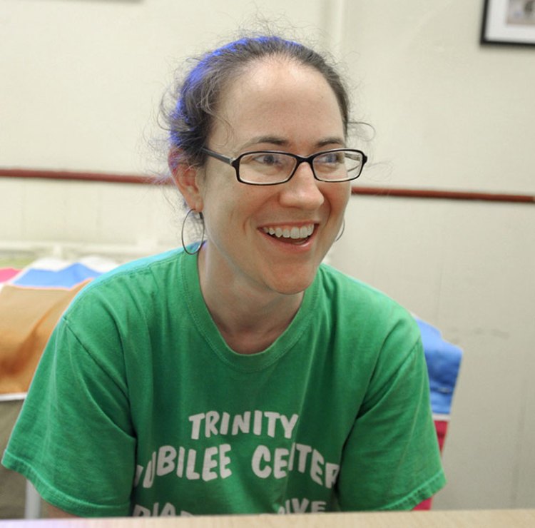 Erin Reed, the development director at the nonprofit Trinity Jubilee Center in Lewiston, came to the aid of many of her friends and former neighbors after a spate of devastating fires in Lewiston this year. John Patriquin / Staff Photographer