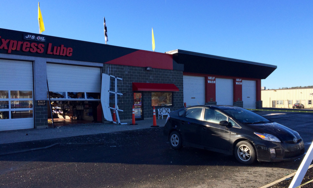 An employee at J&S Oil on Kennedy Memorial Drive was taken to the hospital Monday morning after a customer drove through a bay door. Police believe she mistook the gas pedal for the brake.