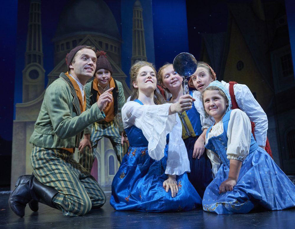 Friends Kai (Ian Carlsen) and Gerda (Britian Seibert) play with local villagers in "The Snow Queen."