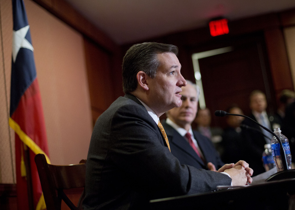 Republican presidential candidate Sen. Ted Cruz, R-Texas and Texas Gov. Greg Abbott speak about the resettlement of Syrian refugees in the U.S., during their joint news conference on Capitol Hill in Washington, Tuesday.