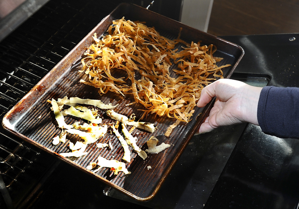 Christine Burns Rudalevige creates flavored salts from carrot, ginger, celery root and beet peels. She dries the peels in the oven then grinds them. Gordon Chibroski/Staff Photographer