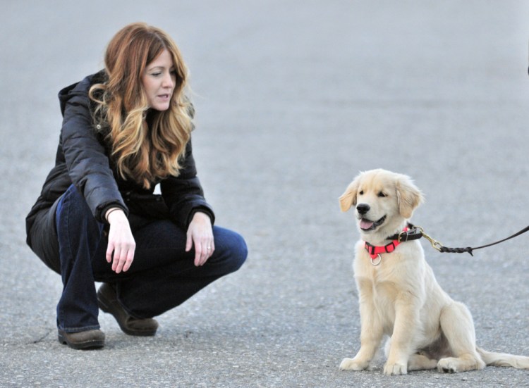 AmyLou Craig, left, and her puppy, Brewer.