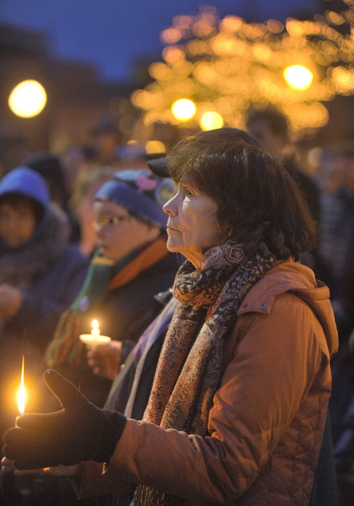 Some people showed their distress over the deaths of 43 homeless people by attending a candlelight vigil Monday evening in Portland.