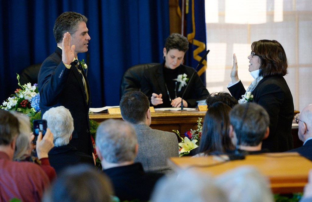 Mayor Ethan Strimling is sworn in by Portland City Clerk Katherine Jones Monday. Strimling succeeds Michael Brennan as Portland's popularly elected leader.