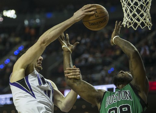 Kings center Kosta Koufos blocks Celtics forward Jae Crowder in the first half in Mexico City on Thursday. The Associated Press