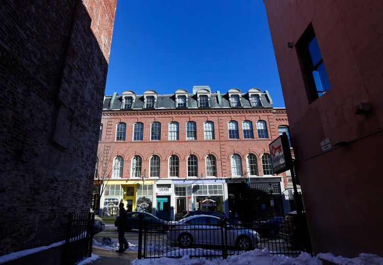 A sign advertises a store for rent on Exchange Street in Portland. A frenzy of commercial real estate transactions in 2015 has left very little available space in the city’s industrial, retail and office zones.