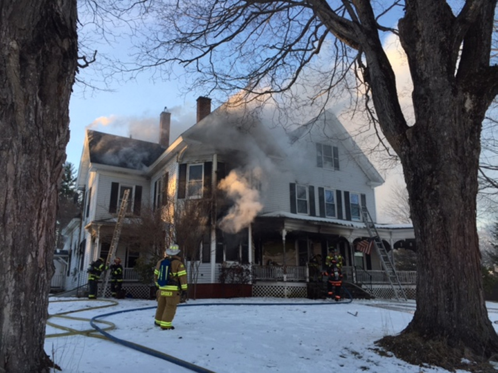 Firefighters work the scene at 37 Riverview Drive in Gardiner on Wednesday.