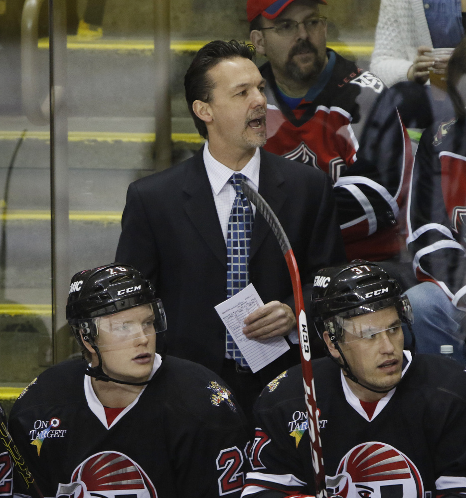 Pirates Coach Scott Allen shouts instructions during Sunday’s game against the Lehigh Valley Phantoms. Portland lost, 2-1, in Allen’s third game as head coach.