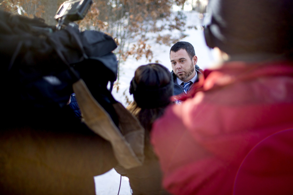 Patrick McDonough, who lives next door to the Windham home in which a woman was shot to death Thursday, addresses the media on Brookhaven Drive on Thursday afternoon.