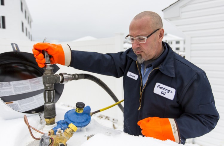 Dave Marr, a driver for Fielding Propane and Oil, delivers propane to a Scarborough housing development. 
Photo by Ben McCanna/Staff Photographer