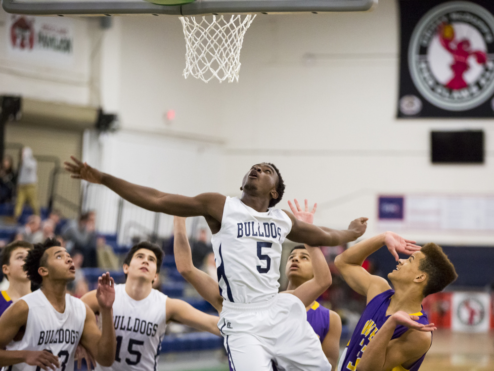 Portland freshman Pedro Fonseca watches the ball Wednesday night after taking a shot against Cheverus. Portland took charge early, opening a 48-17 lead, and never was threatened in a 72-42 victory at the Expo.