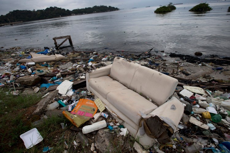 In 2013, a discarded sofa littered the shore of Guanabara Bay in Rio de Janeiro, Brazil. About 1,600 athletes will compete in Rio during the 2016 Summer Olympics. Experts say athletes will be competing in the viral equivalent of raw sewage with exposure to dangerous health risks almost certain.