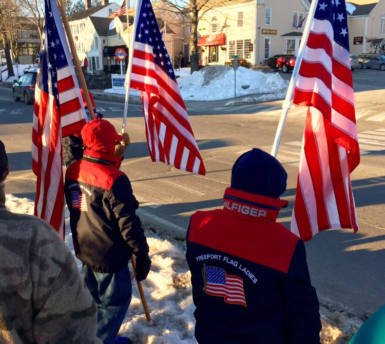 The Freeport Flag Ladies wave flags in Freeport a day after losing their protection-from-harassment order in District Court.
Carl D. Walsh/Staff Photographer