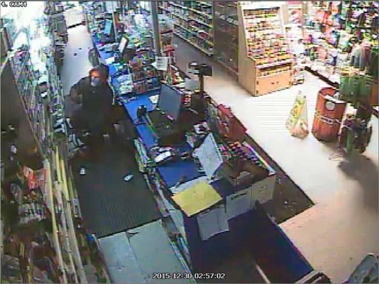 This image from a surveillance camera shows a burglar in the Cigarette Shop on St. John Street, one of six Portland store burglaries in which cigarettes and cash were stolen.