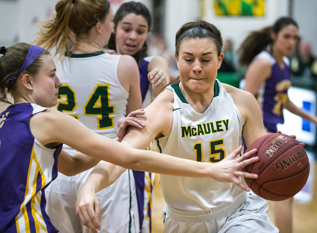 McAuley senior Brooke Howard drives on Cheverus junior Brooke Dawson. Michael Strout