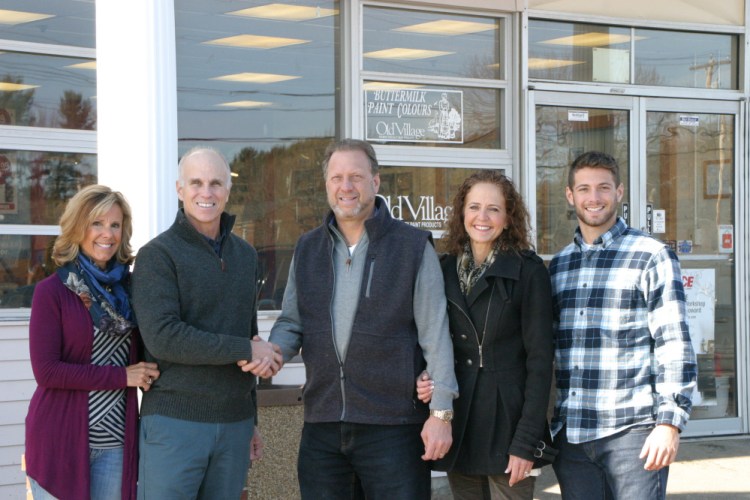 Gayle and John Hichborn, owners of Rogers Ace Hardware, congratulate Rocco, Donna and son Johnny Falcone; the new business owners.