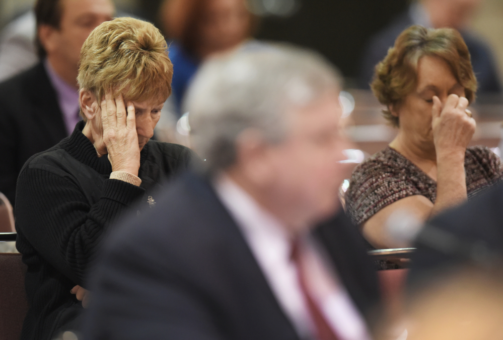 Val Champa, left, the mother of Louis Champa, Jr. who was lost with other crew members when the El Faro sank, listens to phone call recordings from the ship's Capt. Michael Davidson, in Jacksonville, Fla., during a U.S. Coast Guard investigative hearing.