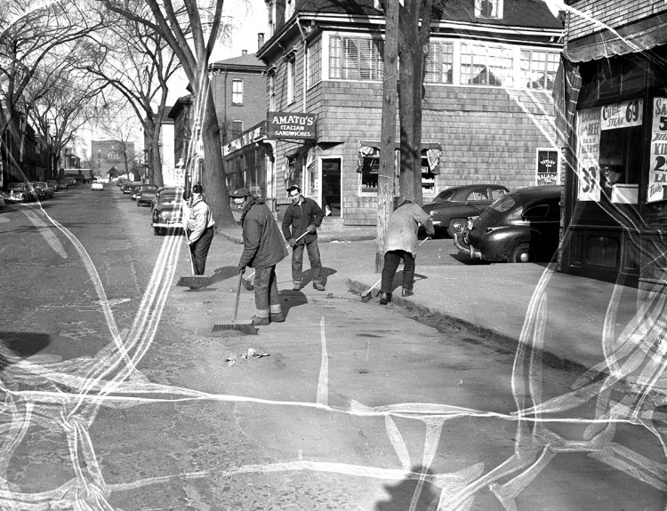 This photograph, which originally appeared on the cover of the January 17, 1955 Portland Evening Express, shows the old Amato’s at the corner of India and Newbury Streets in Portland. The accompanying caption explained that “there’s more sand than snow on Portland’s streets” after a nearly snowless January that year.  