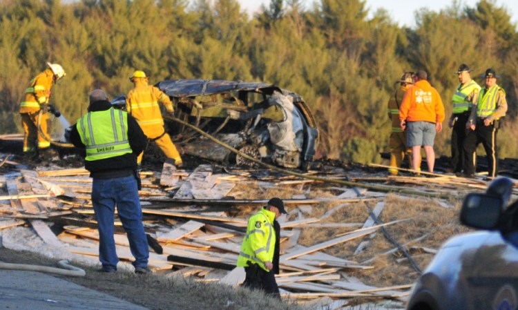 The crash involved six vehicles, including a tractor-trailer carrying a load of lumber, which rolled over into a ditch.
Joe Phelan/Kennebec Journal