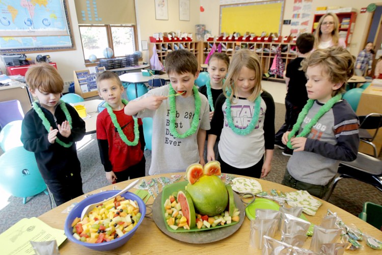 Duncan Blanchard eats a piece of watermelon during his birthday party. Asked about getting to celebrate his real birthday every four years, he said, “It doesn’t bother me.”