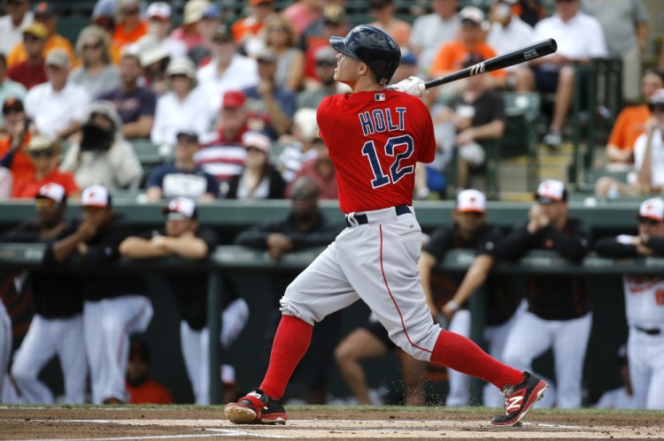 Brock Holt of the Red Sox watches his solo home run in the first inning of Boston’s 5-1 win over Baltimore on Tuesday in Sarasota, Florida.