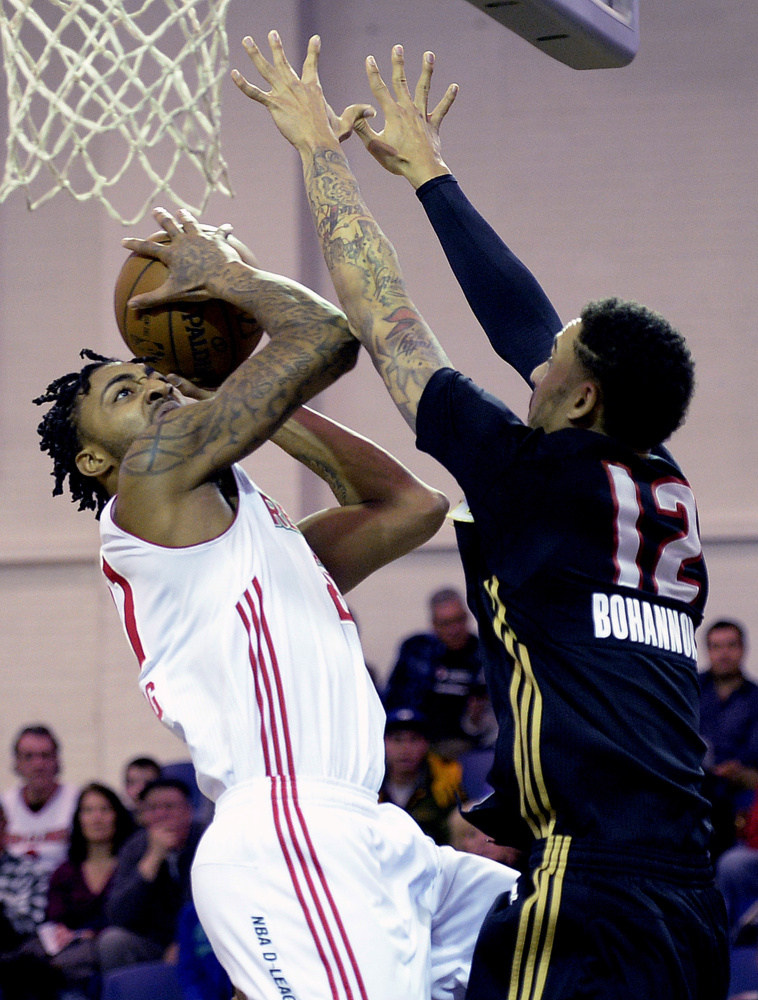 Maine’s James Young drives to the basket against Erie’s John Bohannon during the Red Claws’ on Thursday at the Portland Expo. Young scored 12 points and grabbed eight rebounds.