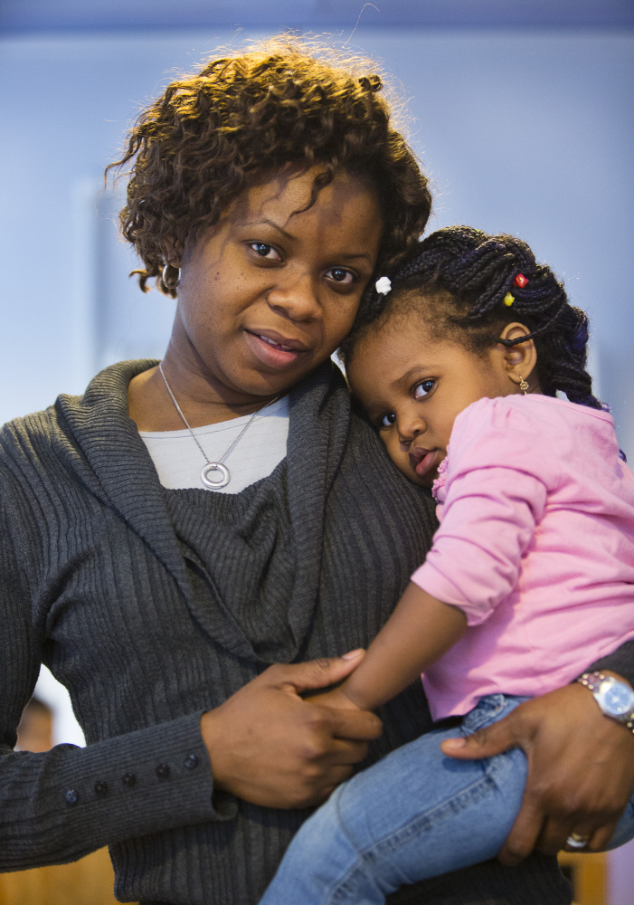 Portland Youth and Family Outreach teacher Evelyne Kanku, with her daughter Benny Kitoko, 2, has benefited from the child care program run by four agencies with help from federal grant funding.